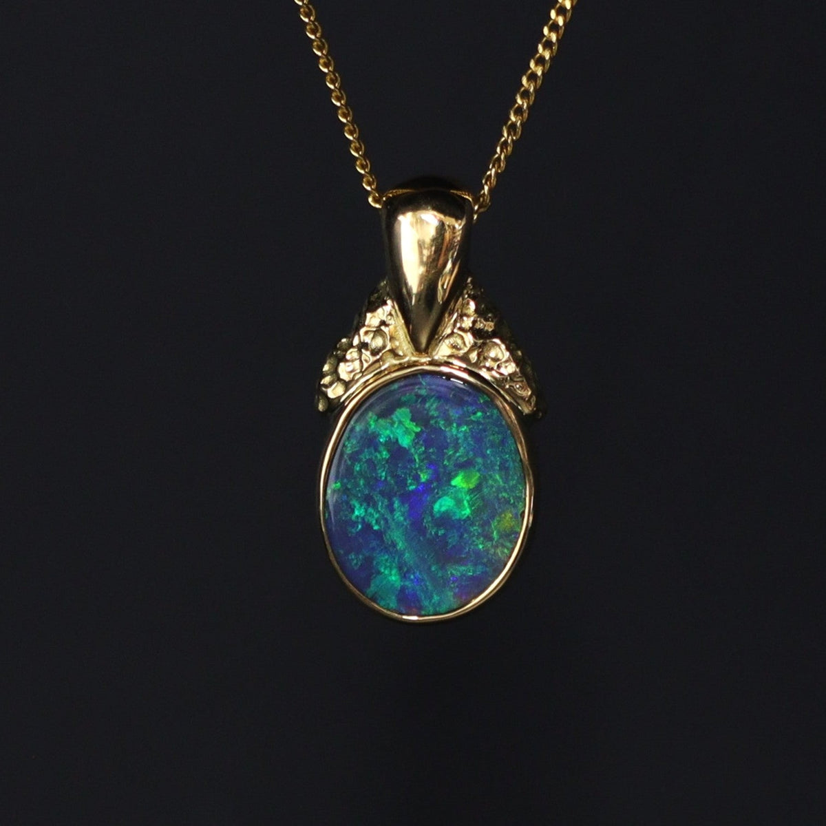 Australian black opal pendant in platinum with red fire and diamond halo — Lightning Ridge