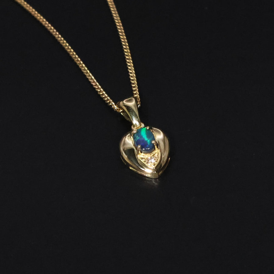 Briliant green rolling flash Black Opal gold pendant