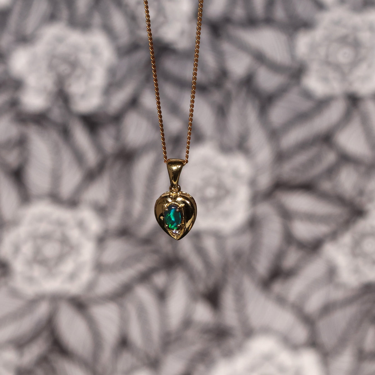 Briliant green rolling flash Black Opal gold pendant