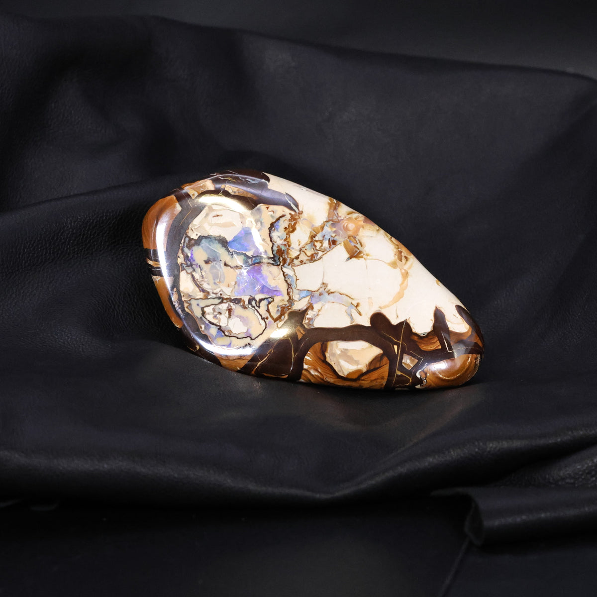 Boulder opal specimen unusual pattern highly polished