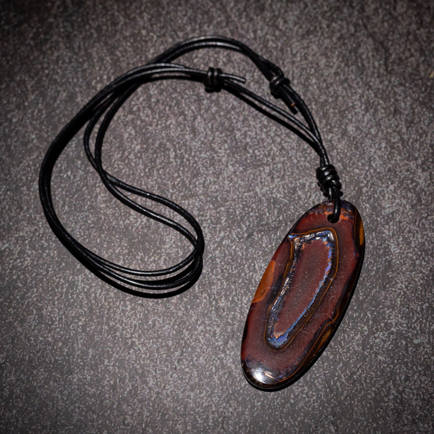 Australian Boulder Opal on leather