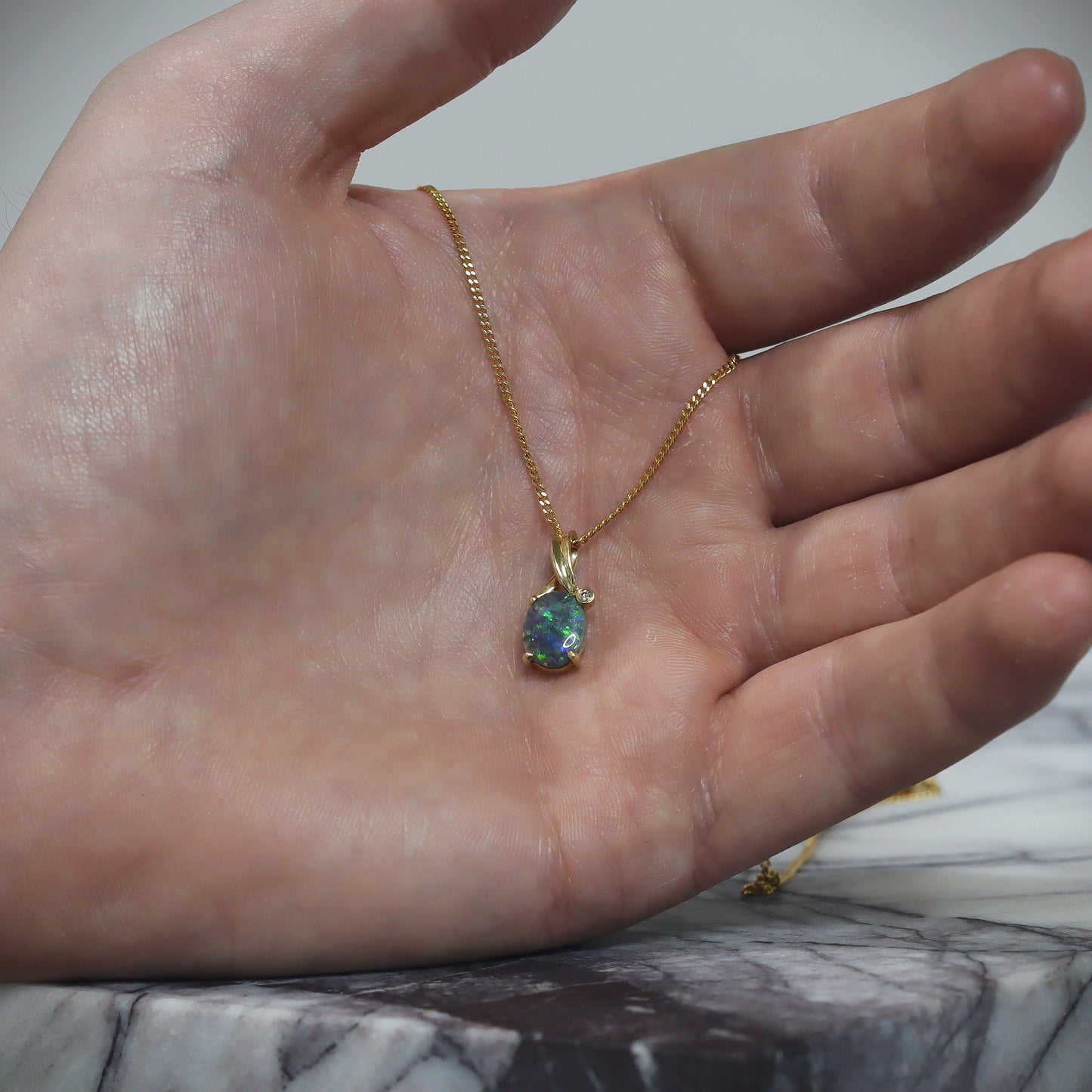 Australian Black solid Opal in 18 karat gold pendant