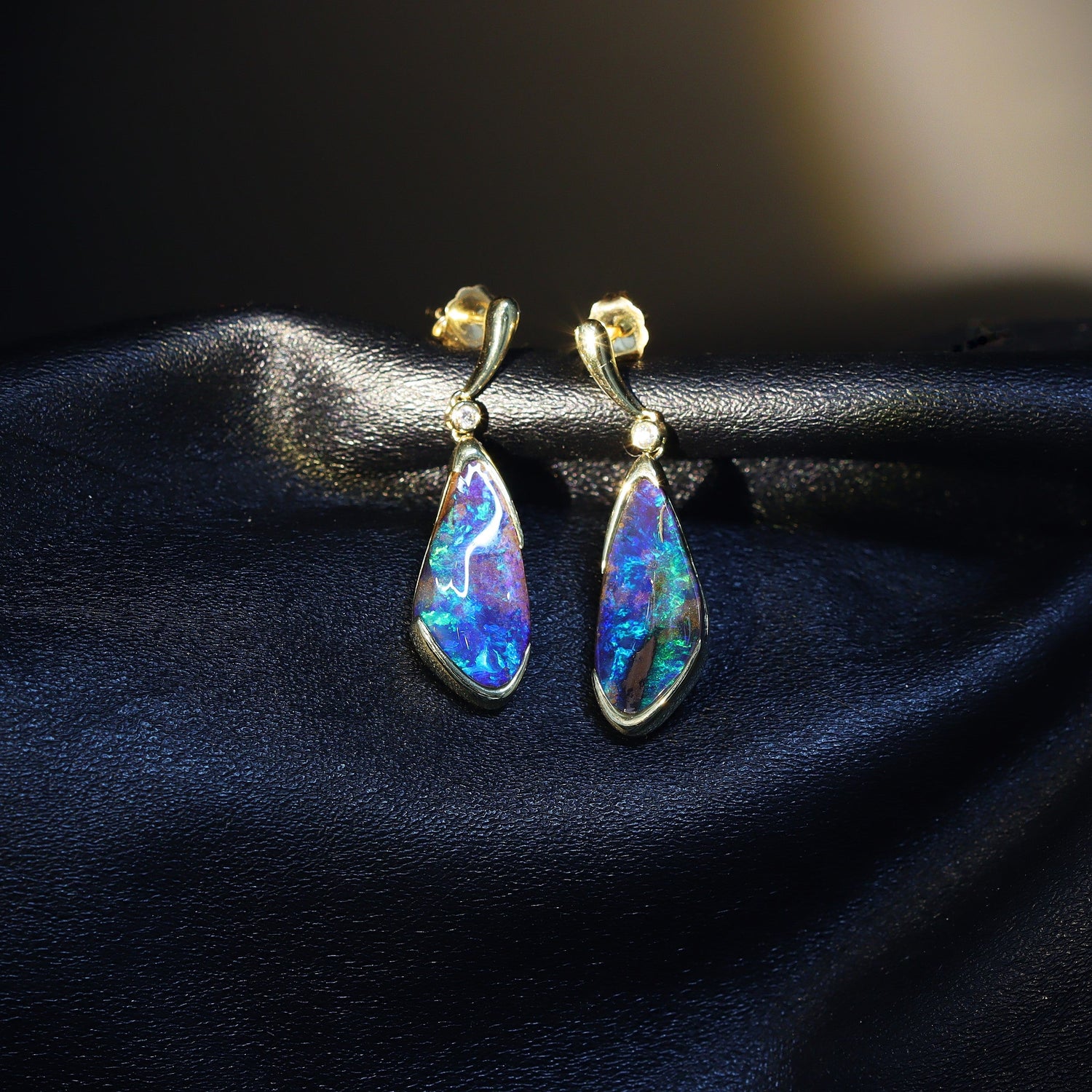 Australian boulder opal earrings in 18 karat yellow gold