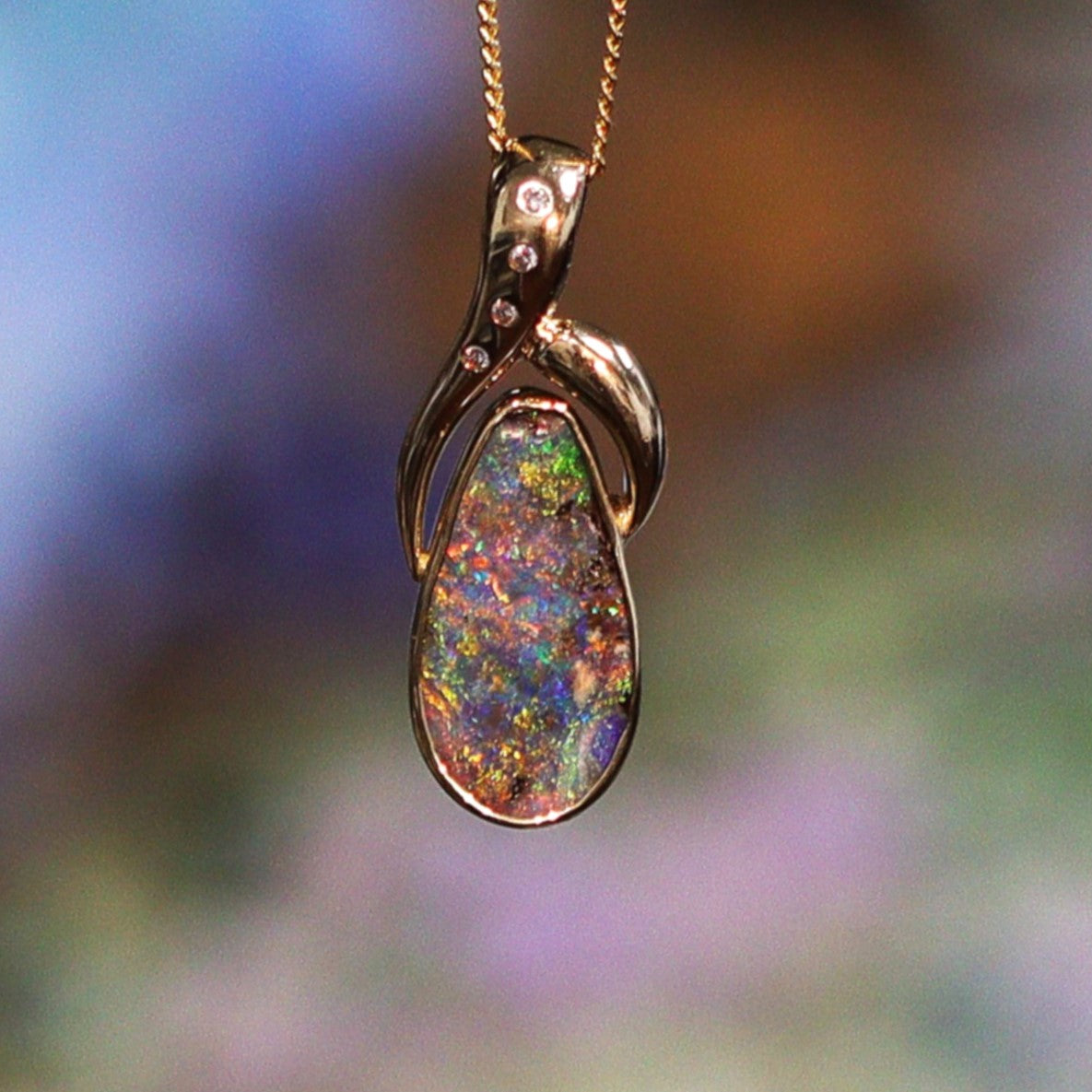 Australian boulder opal pendant in sterling silver — 8.21ct blue with red stripe, Queensland