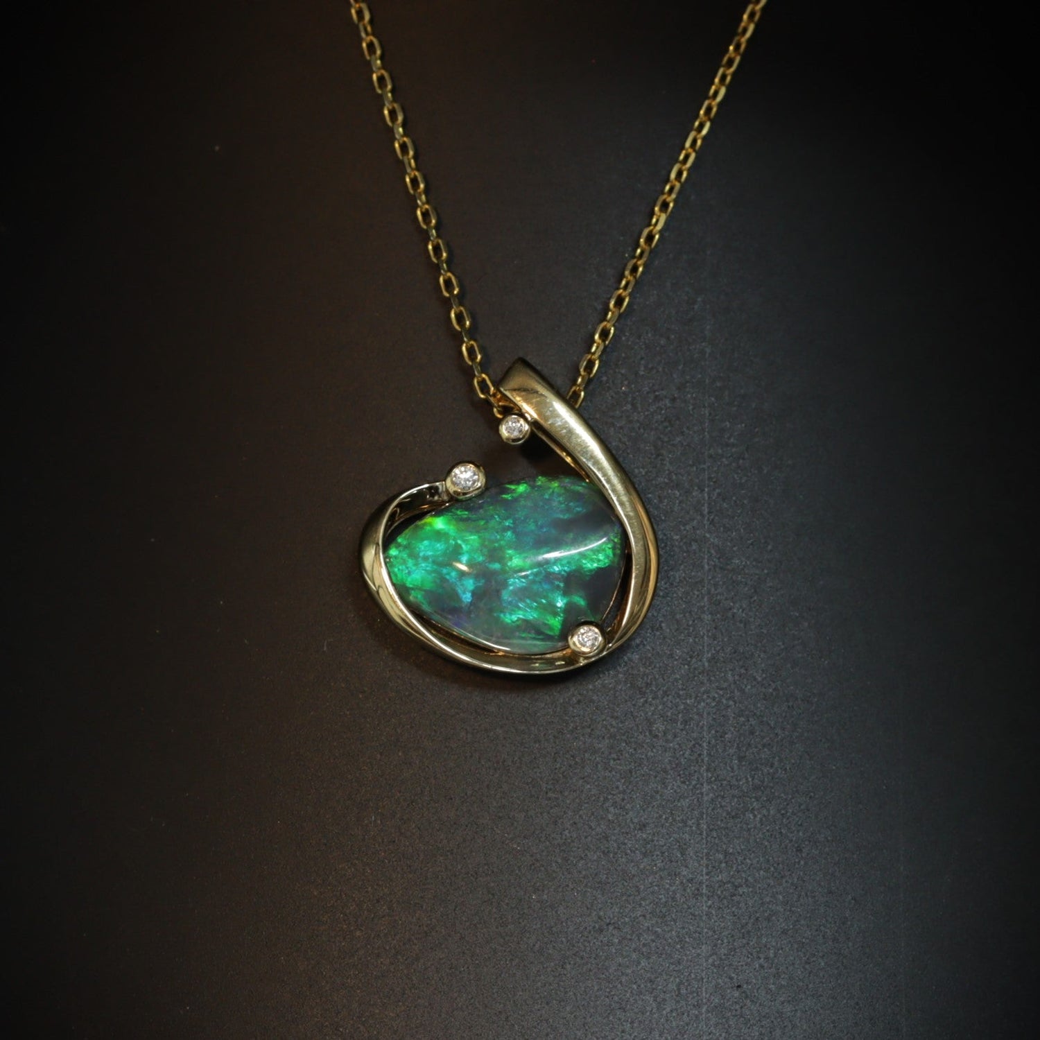 Australian black opal pendant in 18K yellow gold with diamond accents — 3.58ct vivid green fire, Lightning Ridge