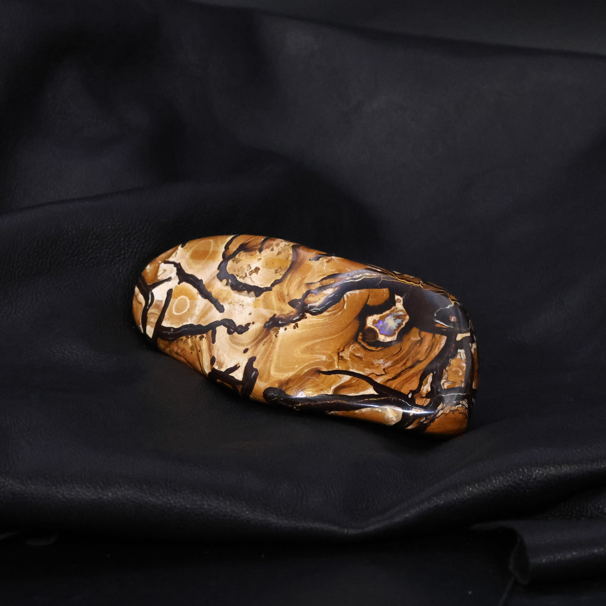 Boulder opal specimen unusual pattern highly polished