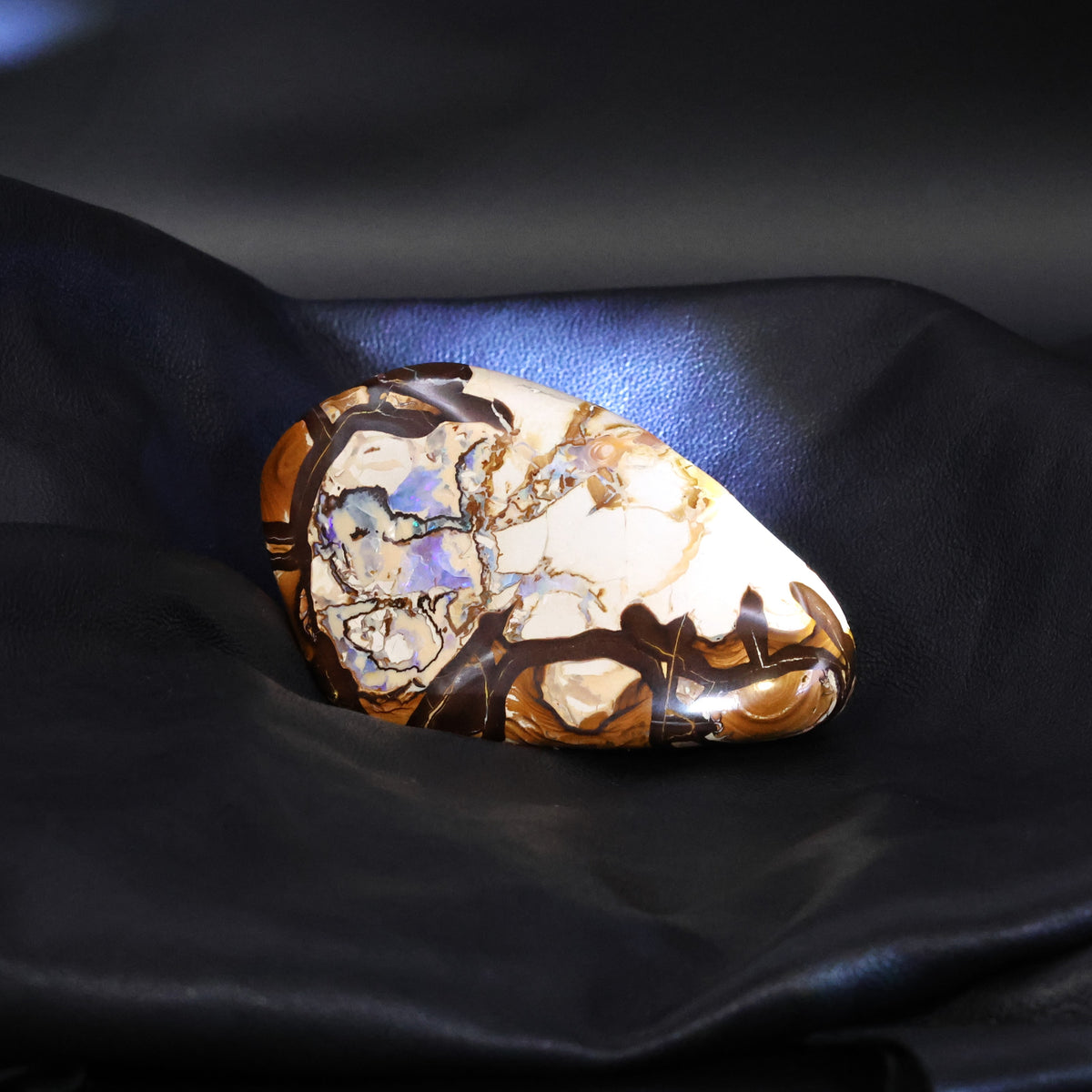 Boulder opal specimen unusual pattern highly polished