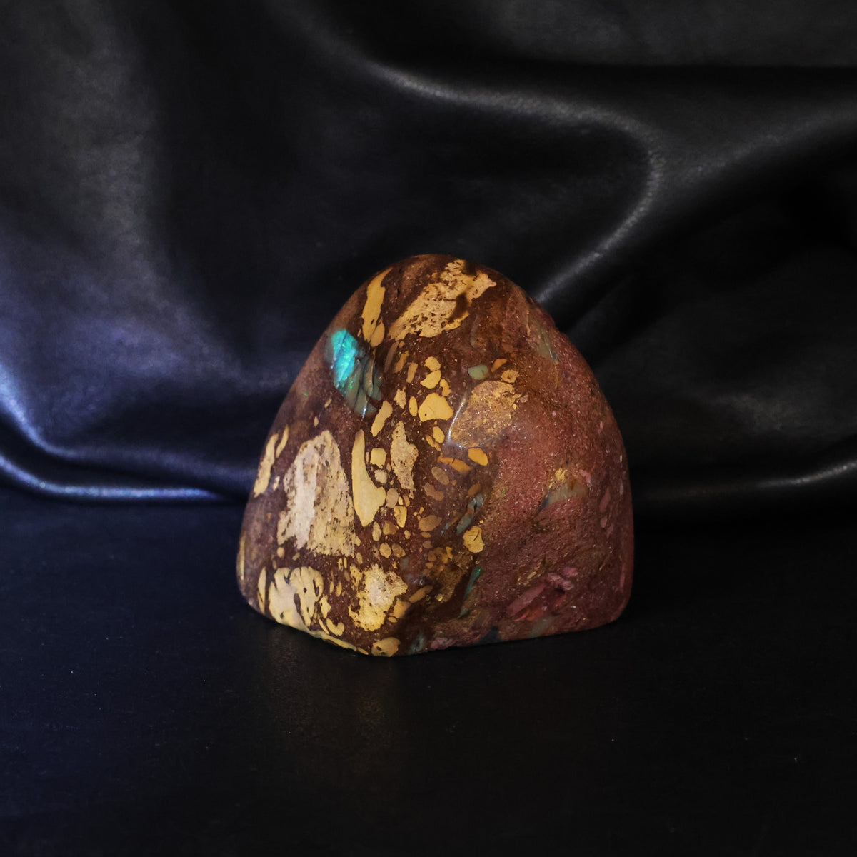 Opal specimen sparks of color in sandy iron stone
