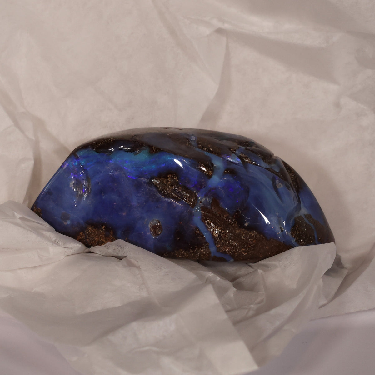 Boulder opal specimen strong blue color 0.10 kg