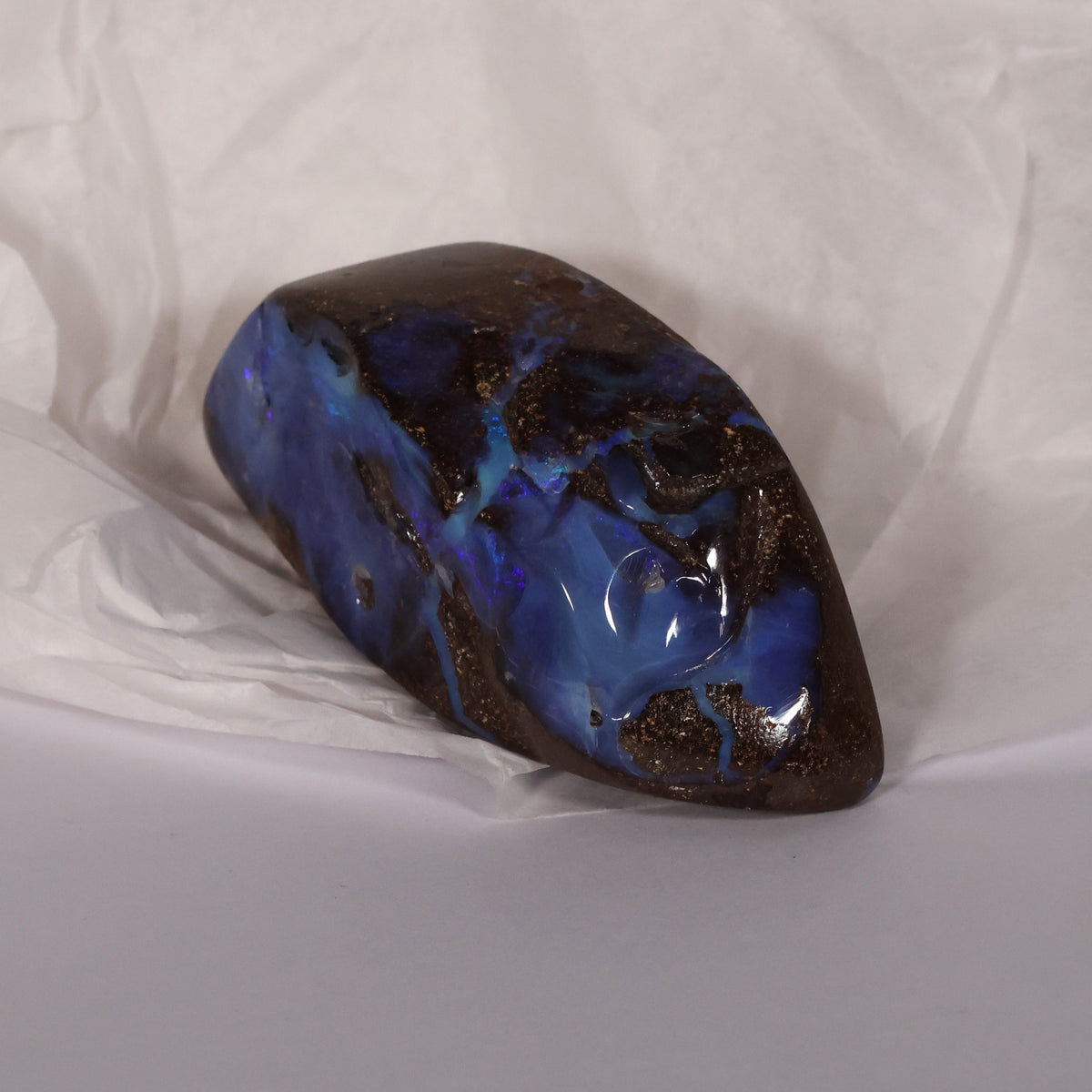 Boulder opal specimen strong blue color 0.10 kg
