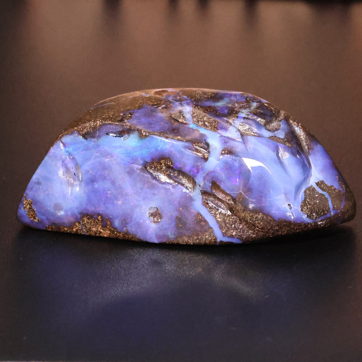 Boulder opal specimen strong blue color 0.10 kg