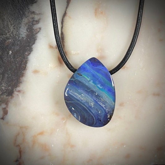 Australian Boulder Opal on leather 