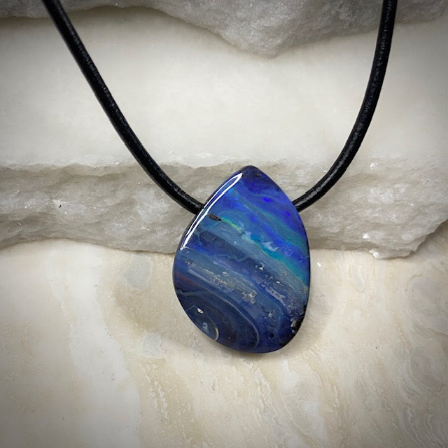 Australian Boulder Opal on leather 