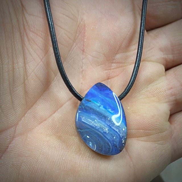 Australian Boulder Opal on leather 