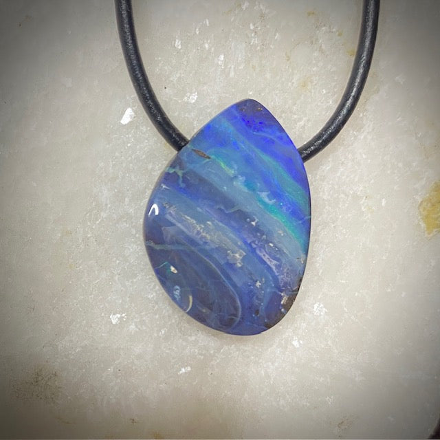 Australian Boulder Opal on leather 