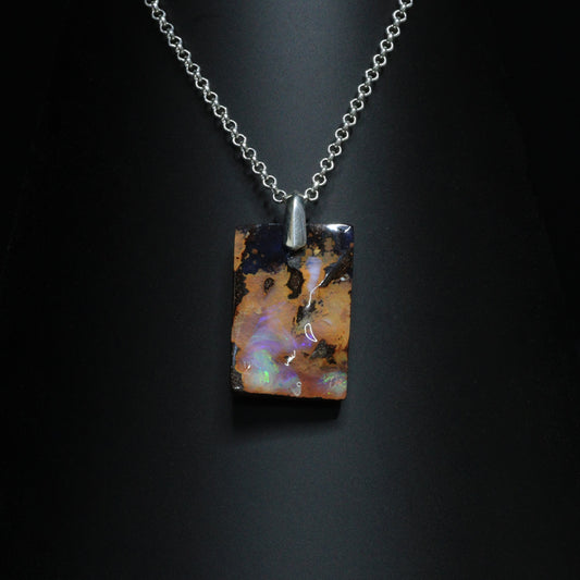 Australian Boulder Opal on leather 