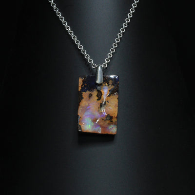 Australian Boulder Opal on leather 