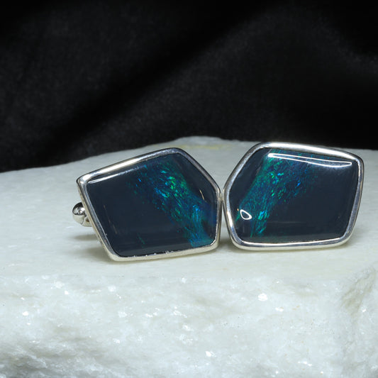 Black opal cufflings in sterling silver