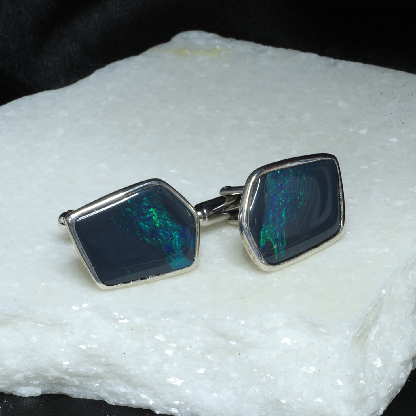 Black opal cufflings in sterling silver