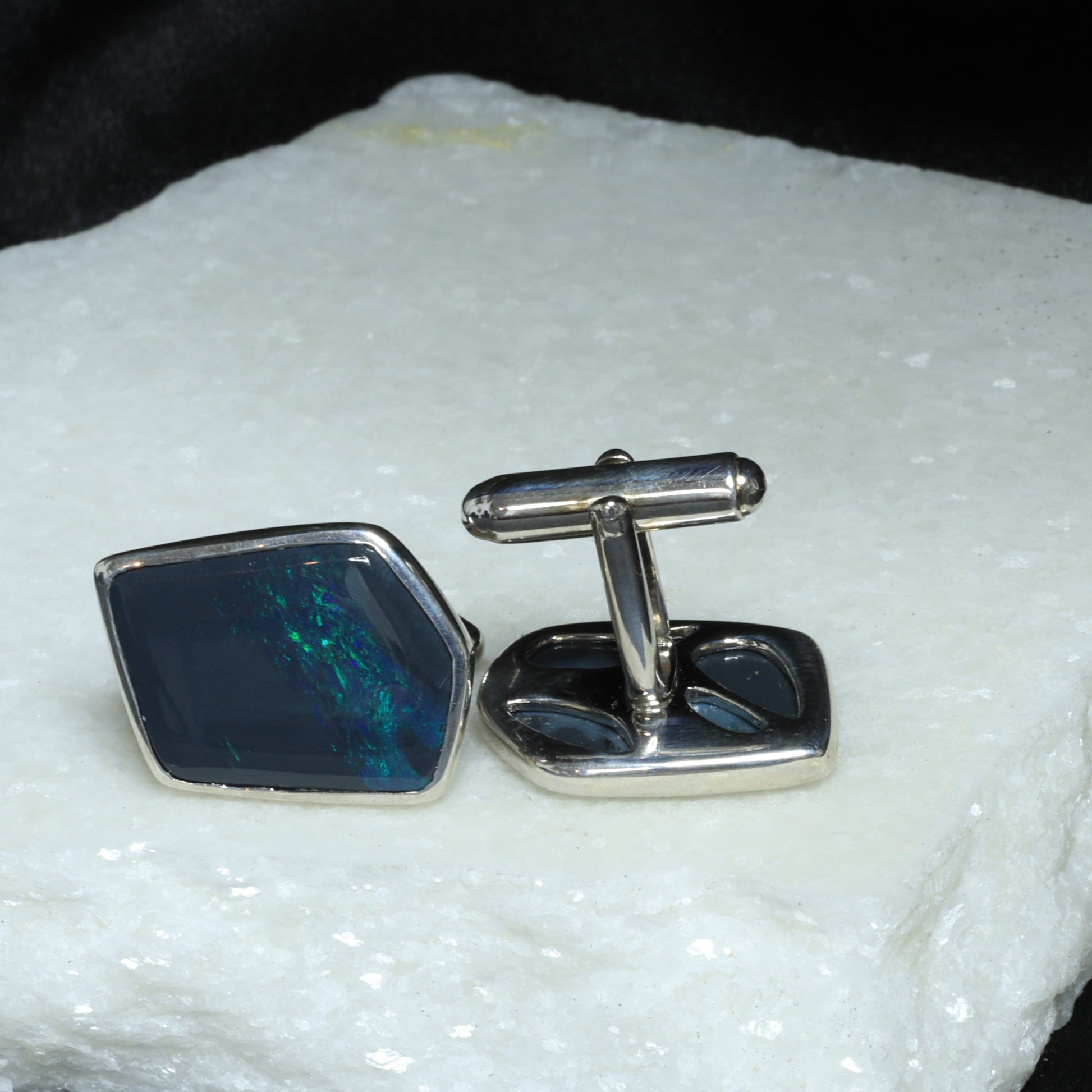 Black opal cufflings in sterling silver