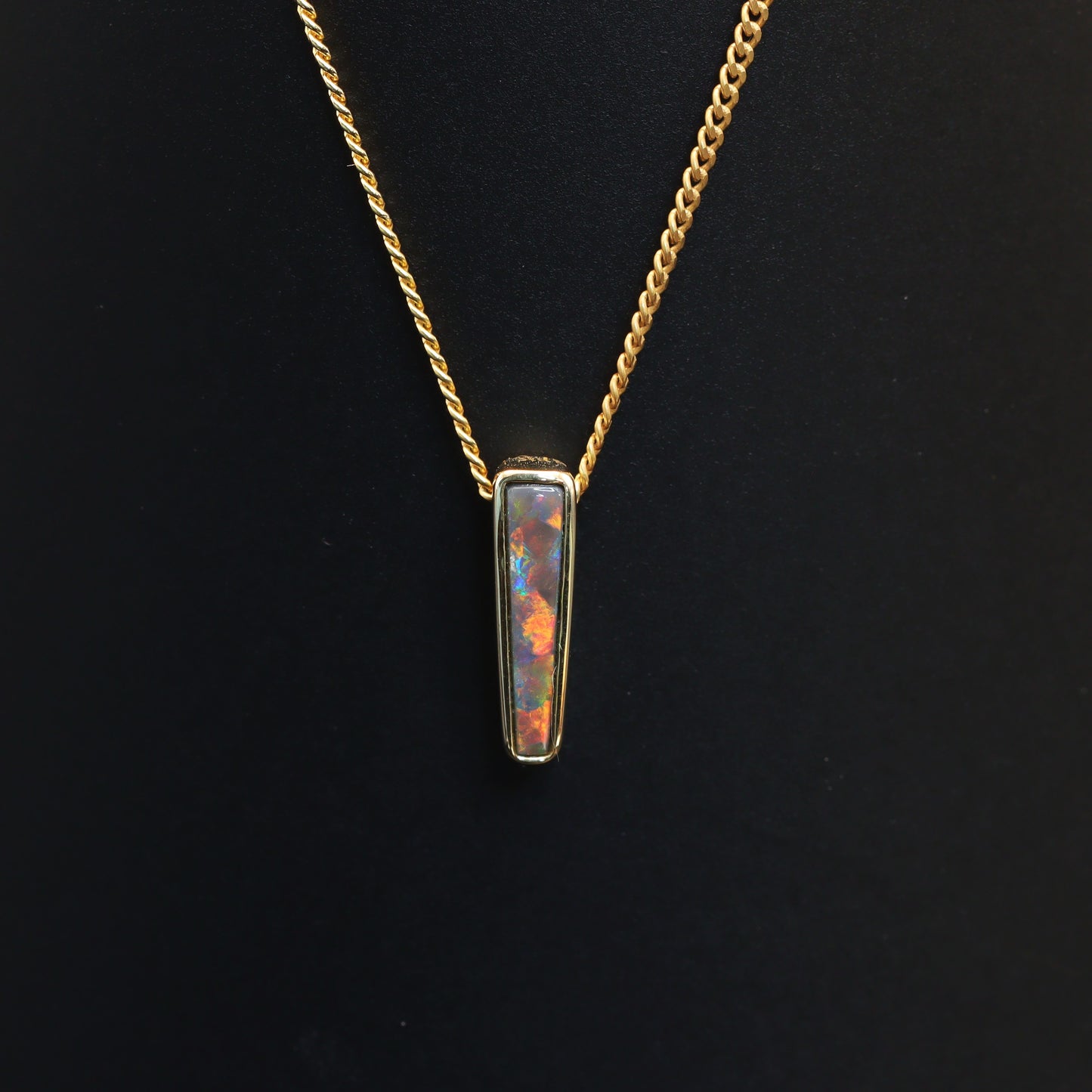 Australian Black solid Opal  in 18 karat gold pendant 