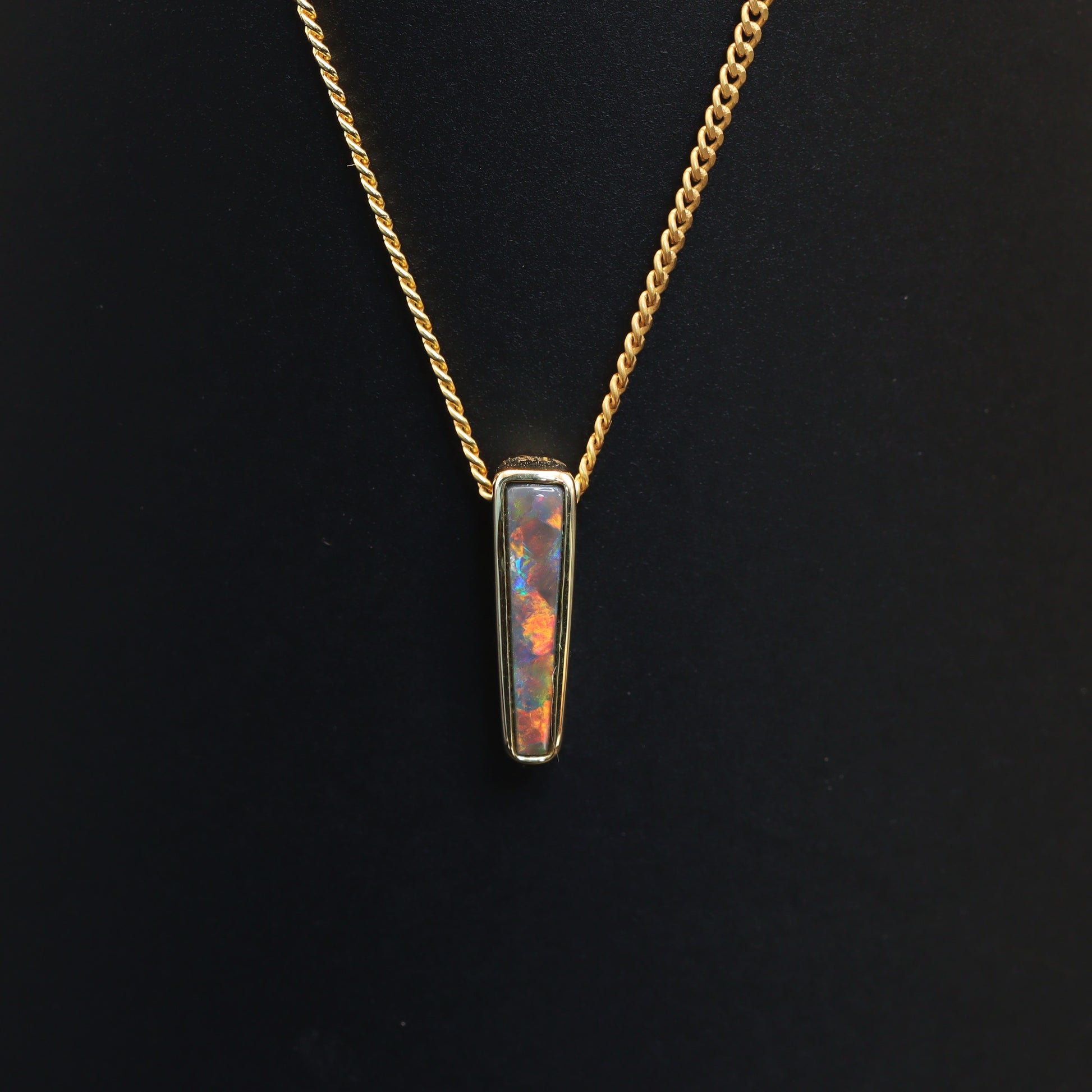 Australian Black solid Opal  in 18 karat gold pendant 