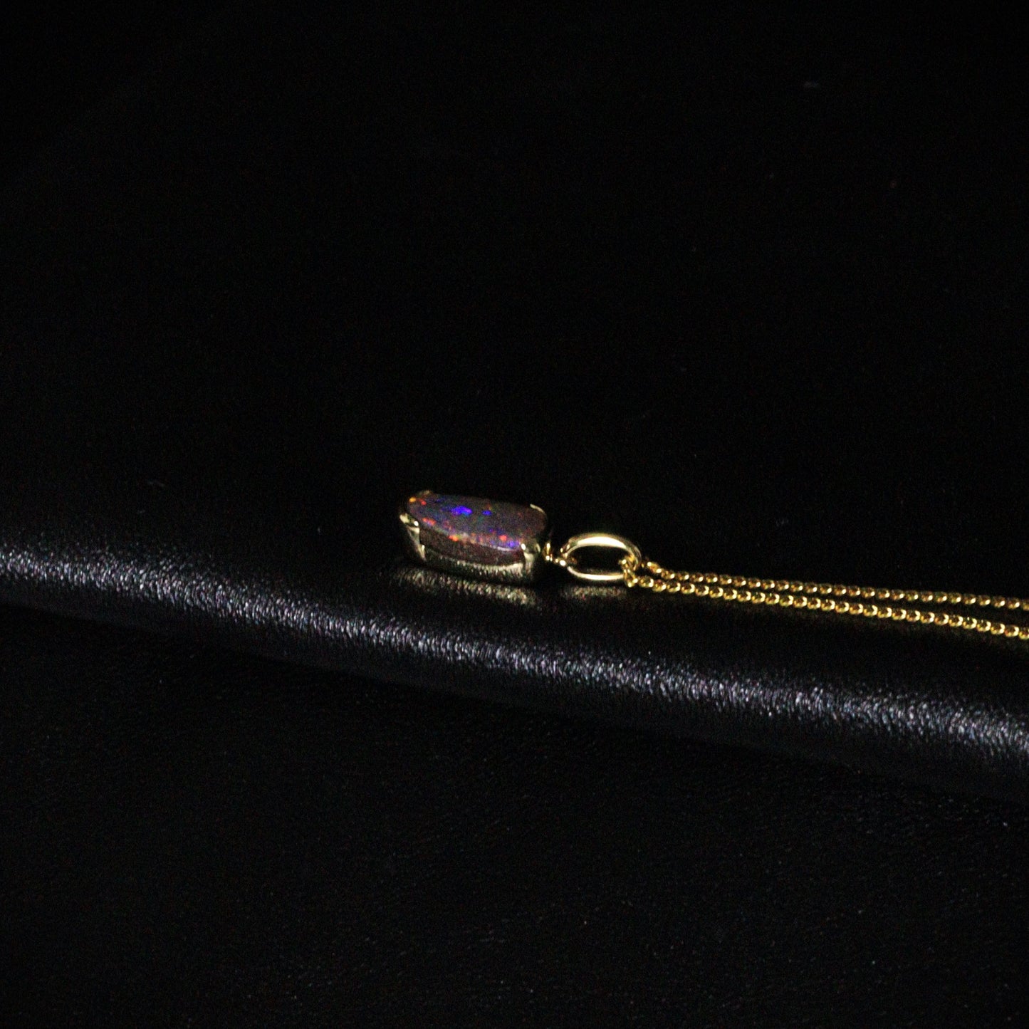 Australian Boulder opal set in 18 K gold pendant