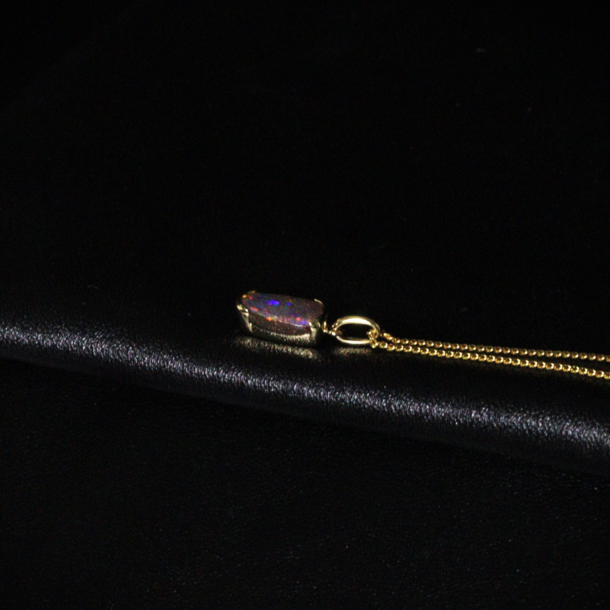Australian Boulder opal set in 18 K gold pendant
