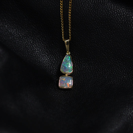 Australian Boulder opal set in 18 K gold pendant