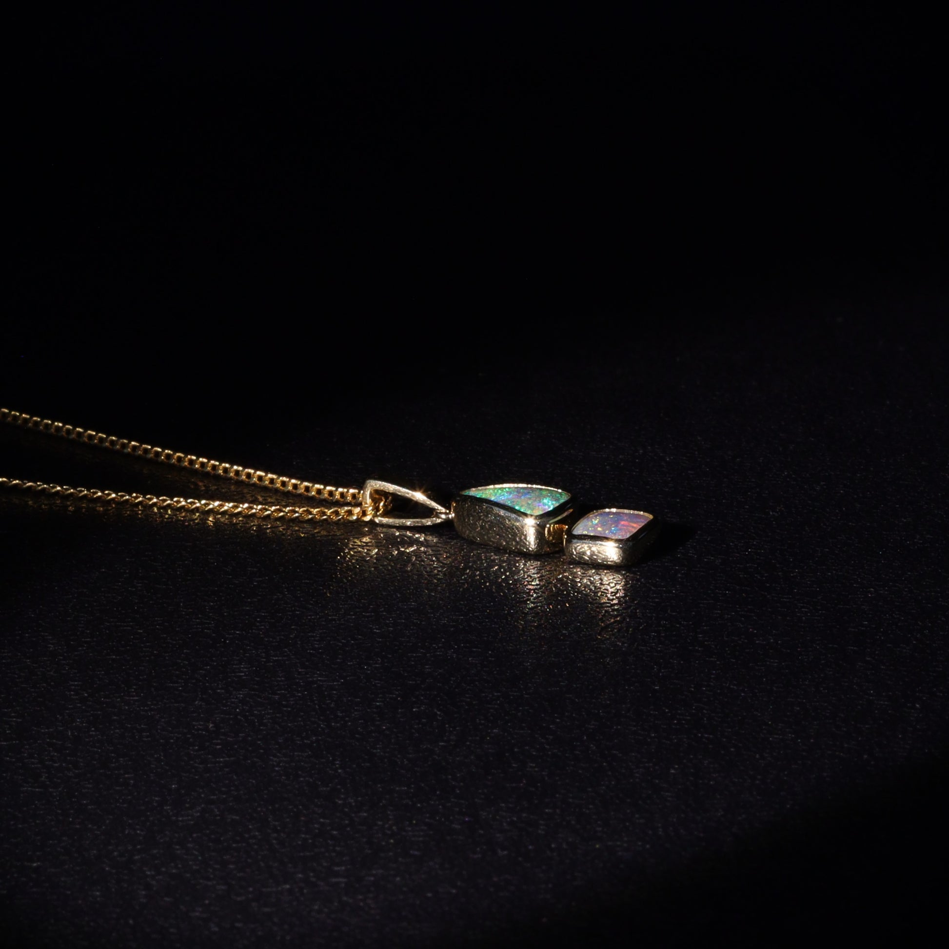 Australian Boulder opal set in 18 K gold pendant