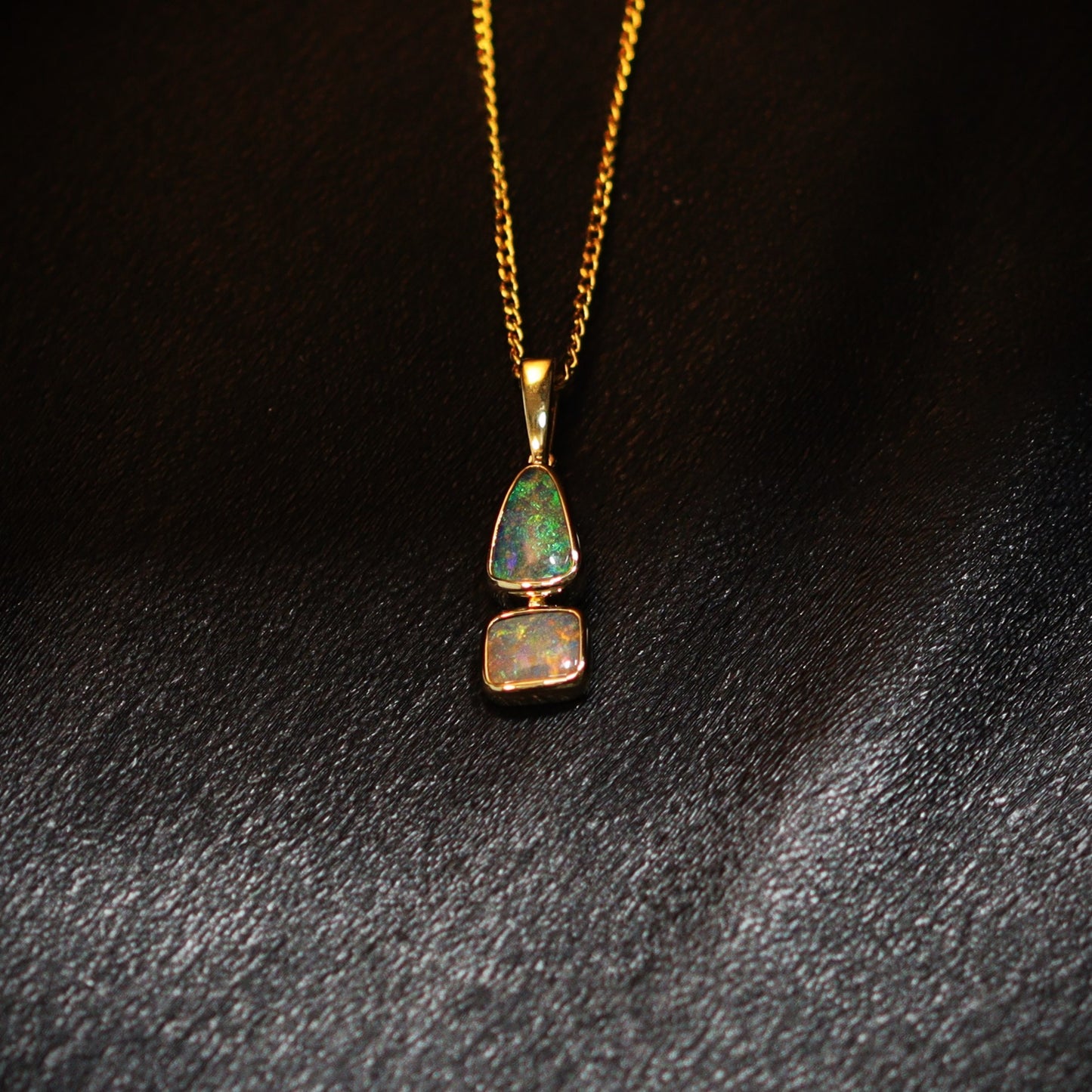 Australian Boulder opal set in 18 K gold pendant