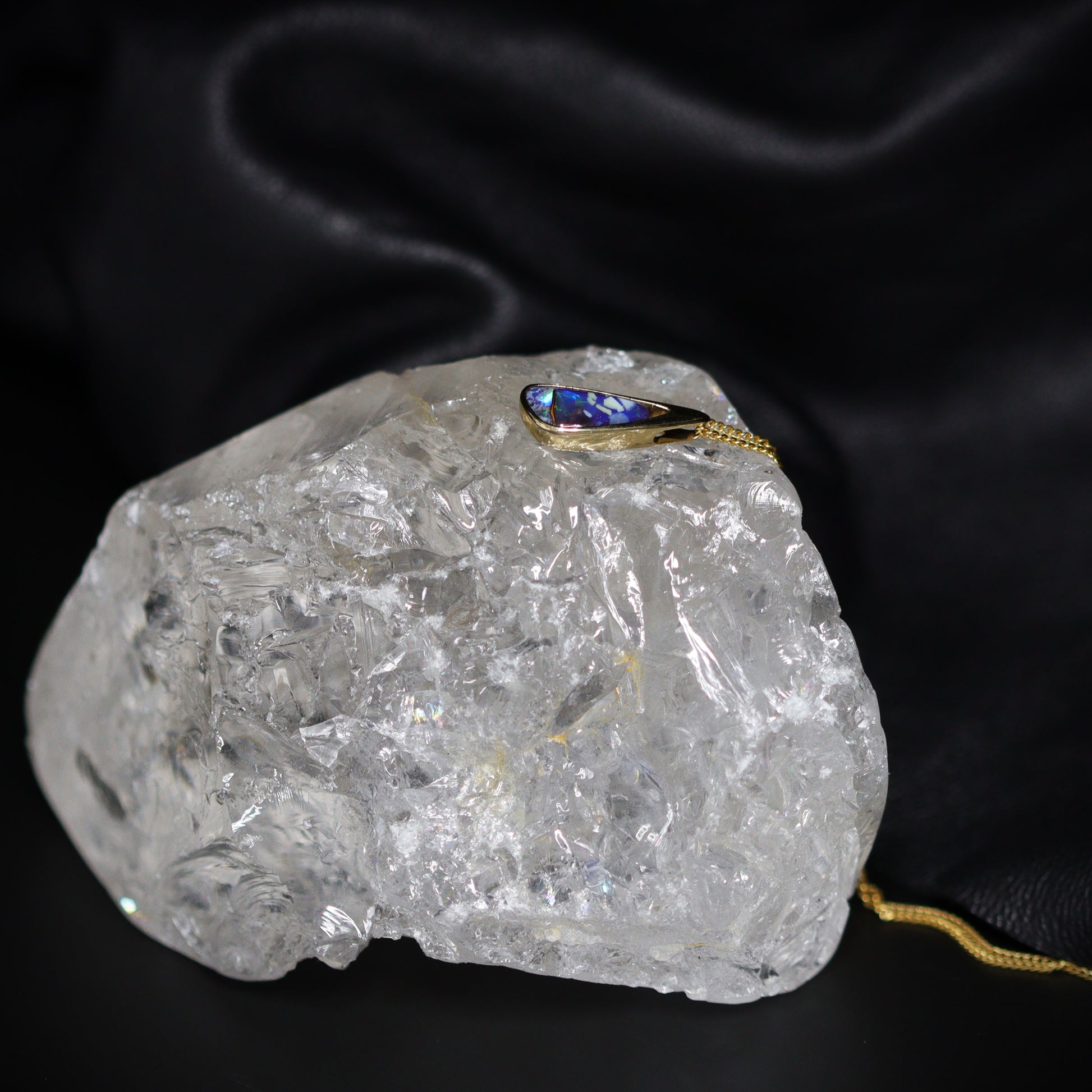 Australian Boulder opal set in 18 K gold pendant