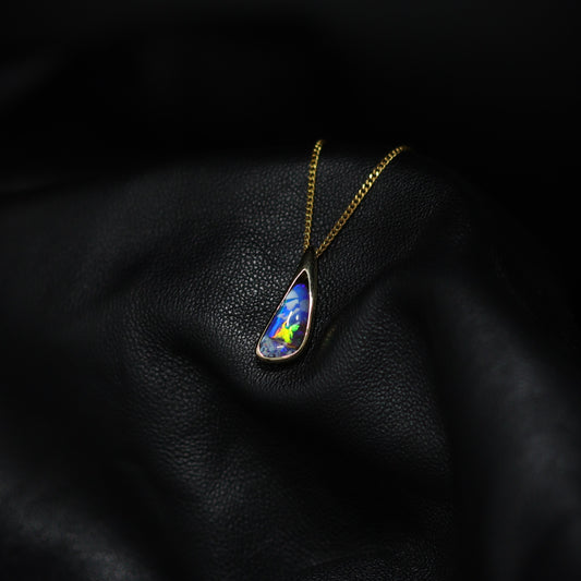 Australian Boulder opal set in 18 K gold pendant