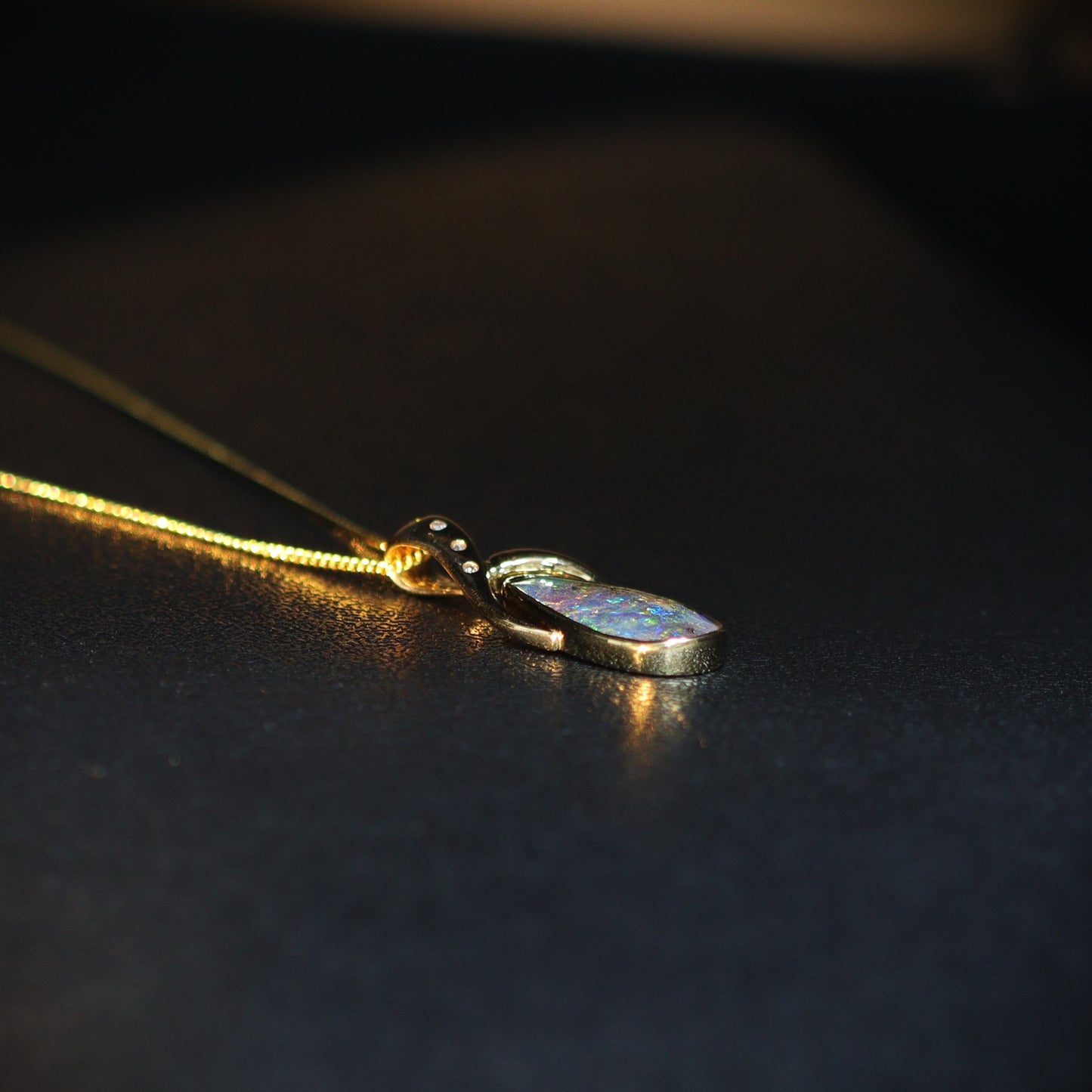 Australian Boulder opal set in 18 K gold pendant