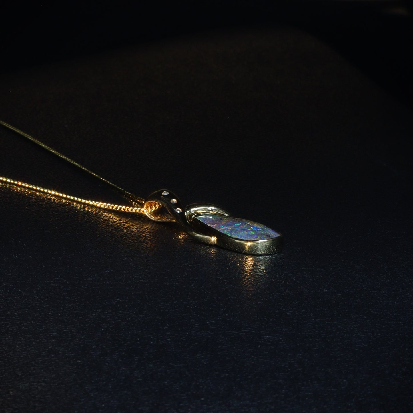 Australian Boulder opal set in 18 K gold pendant