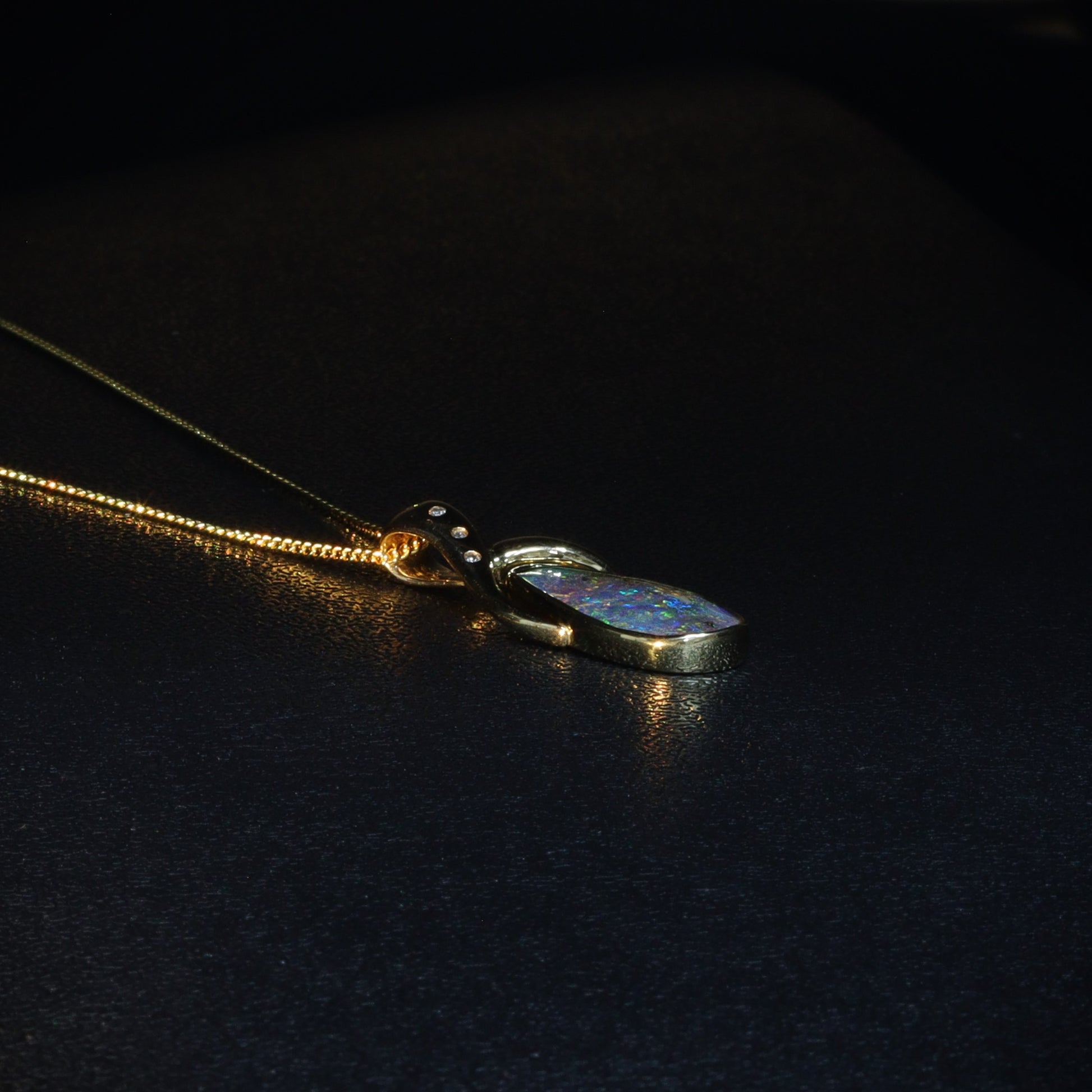 Australian Boulder opal set in 18 K gold pendant