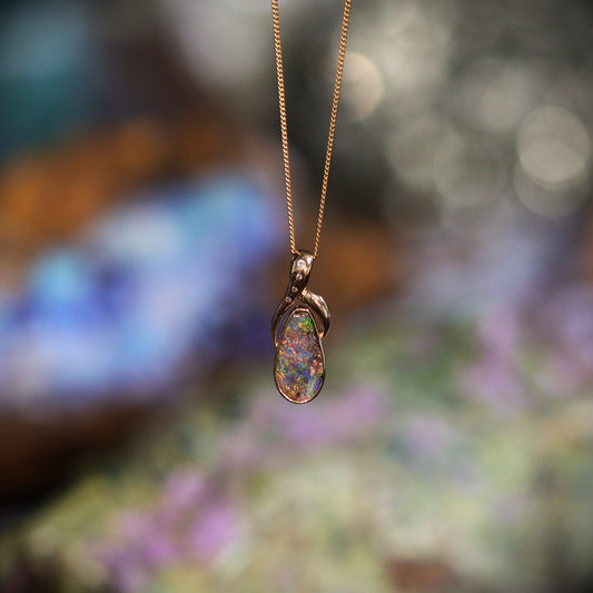 Australian Boulder opal set in 18 K gold pendant