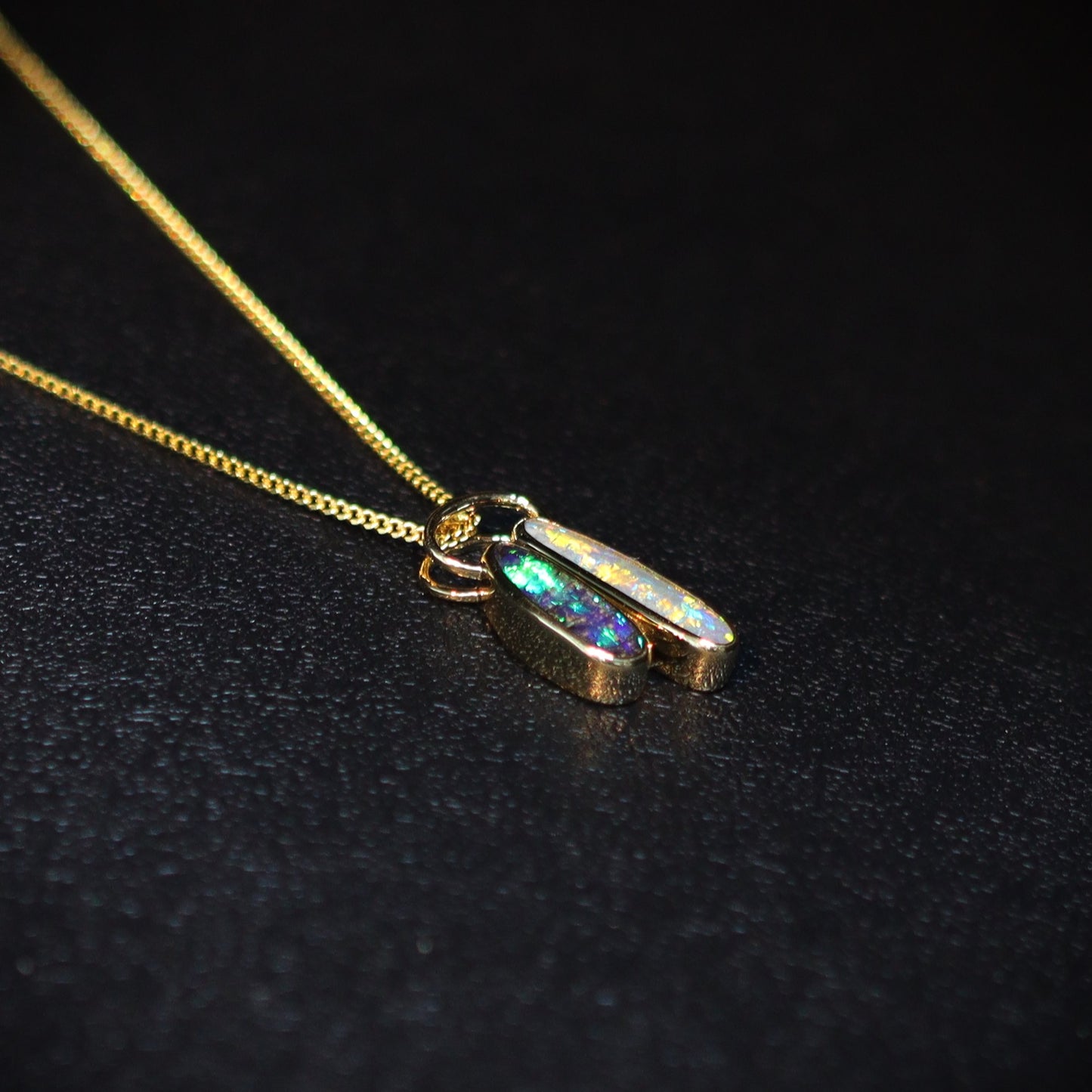 Australian Boulder and Black opal set in 18 K gold pendant