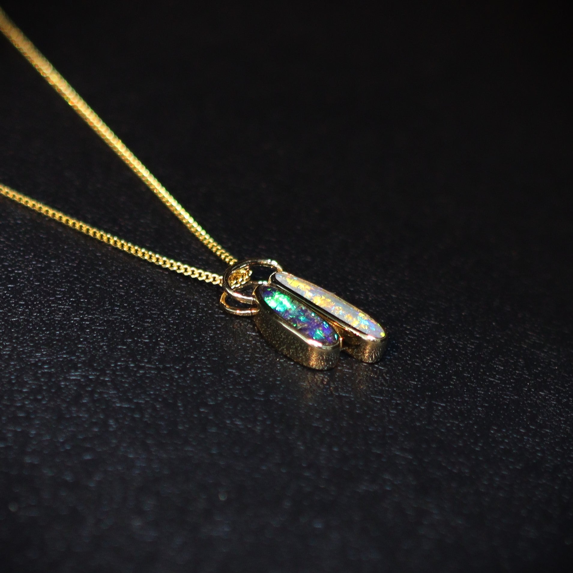 Australian Boulder and Black opal set in 18 K gold pendant