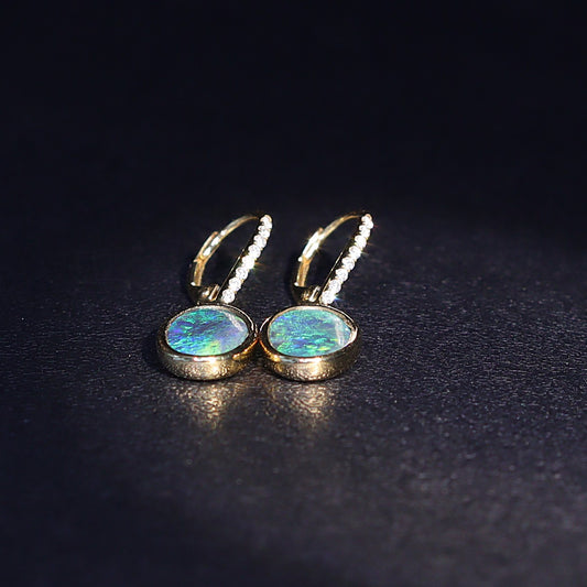 Australian Black Opal 18 karat yellow gold earning 