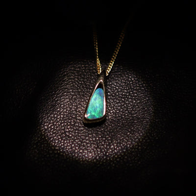 Australian Boulder opal set in 18 K gold pendant
