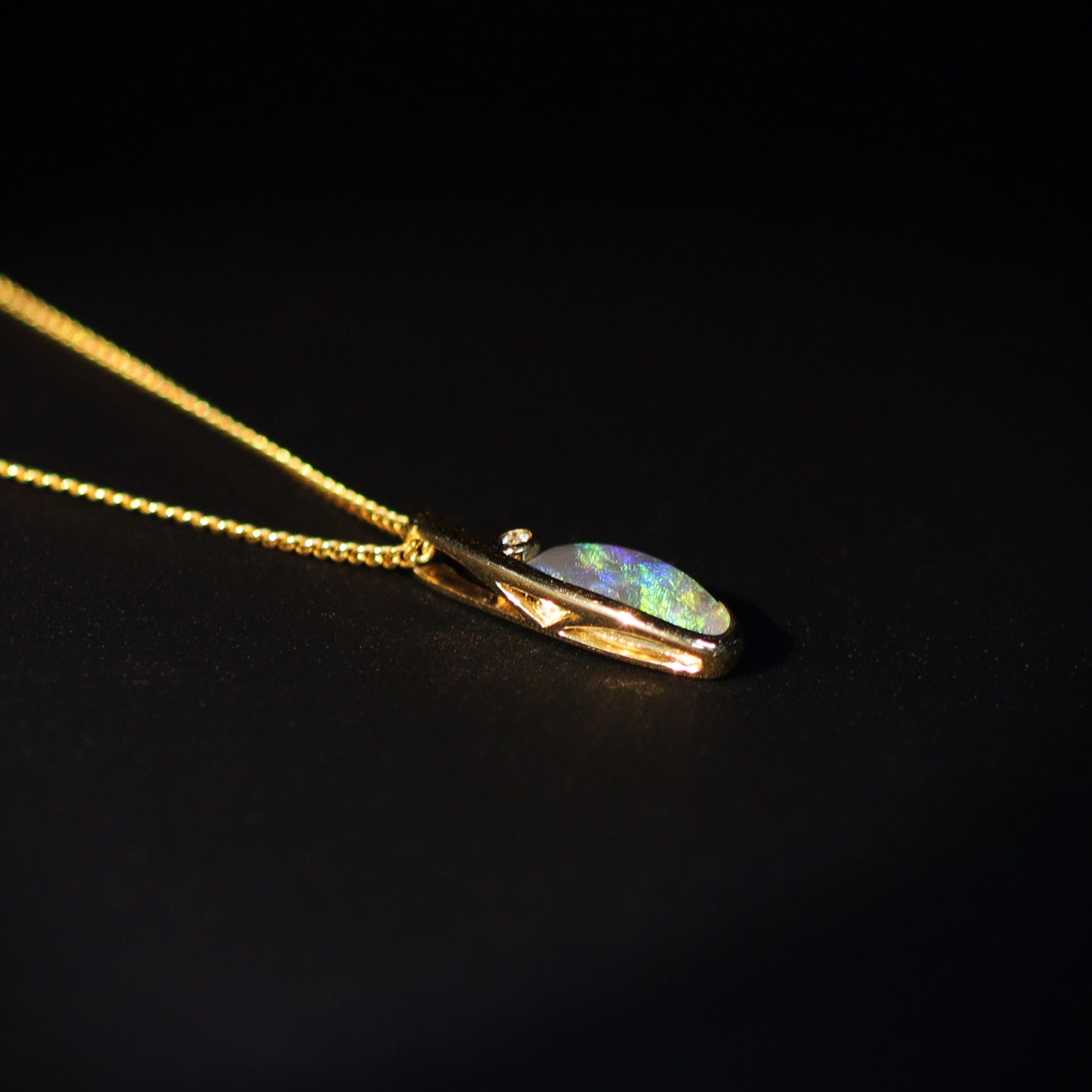 Australian Black opal set in 18 K gold pendant