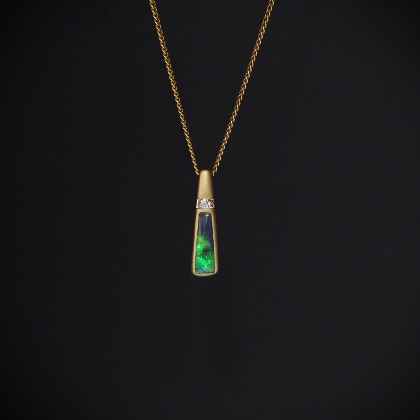 Australian Black Opal set in 18 K gold pendant