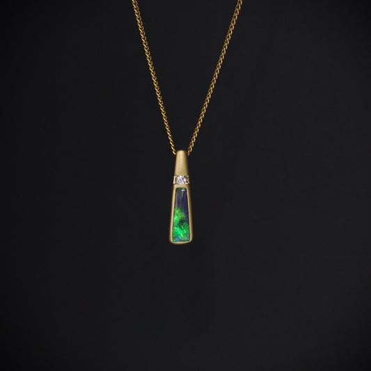 Australian Black Opal set in 18 K gold pendant