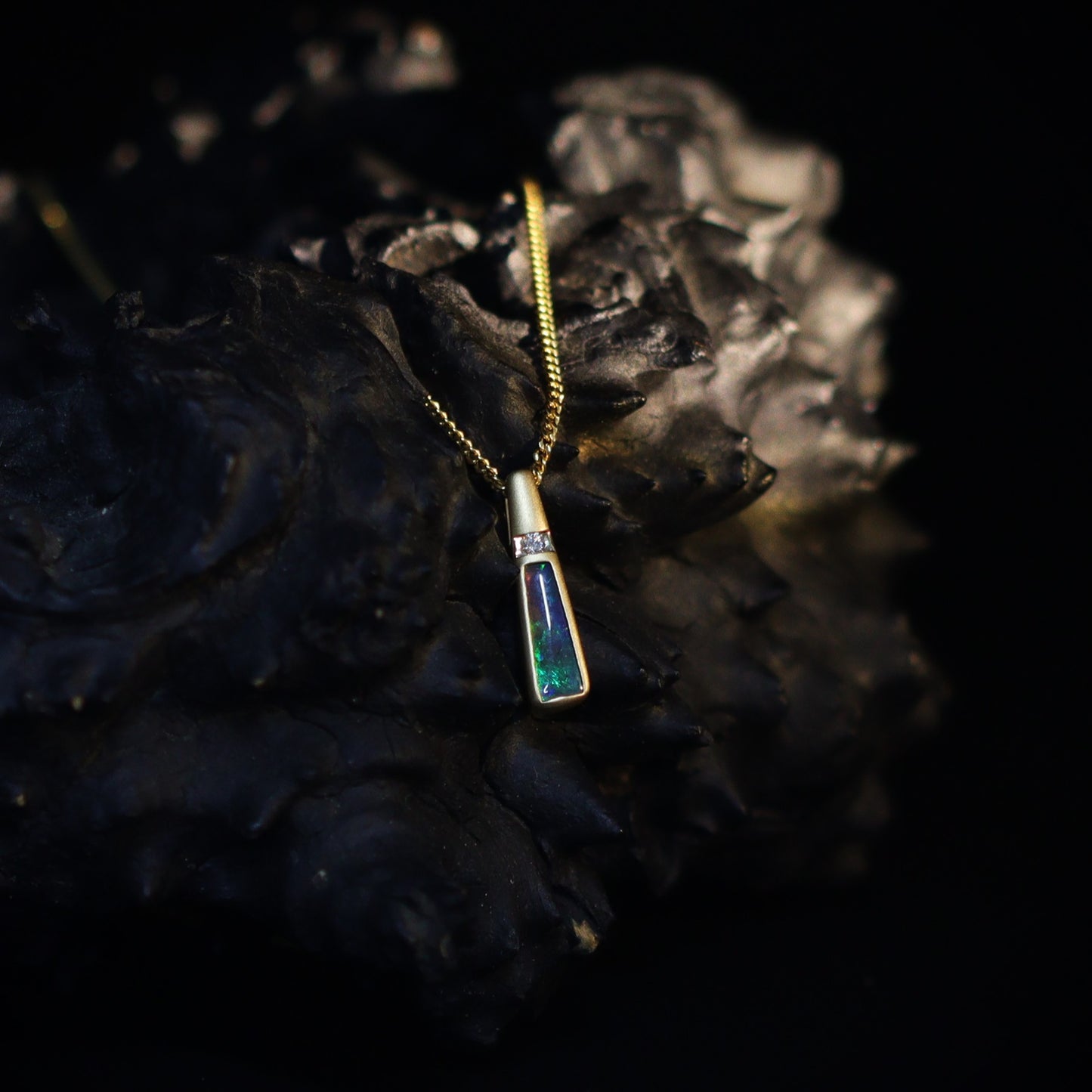 Australian Black Opal set in 18 K gold pendant