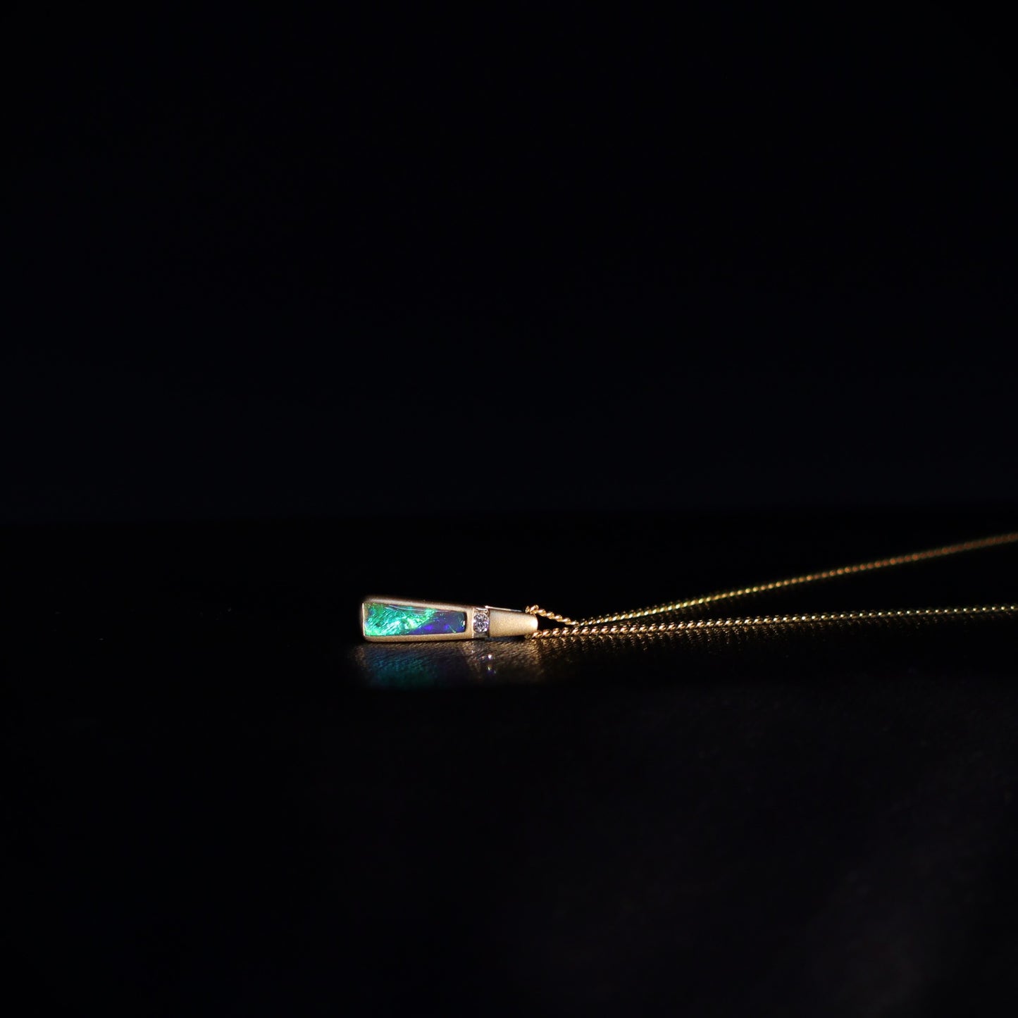 Australian Black Opal set in 18 K gold pendant