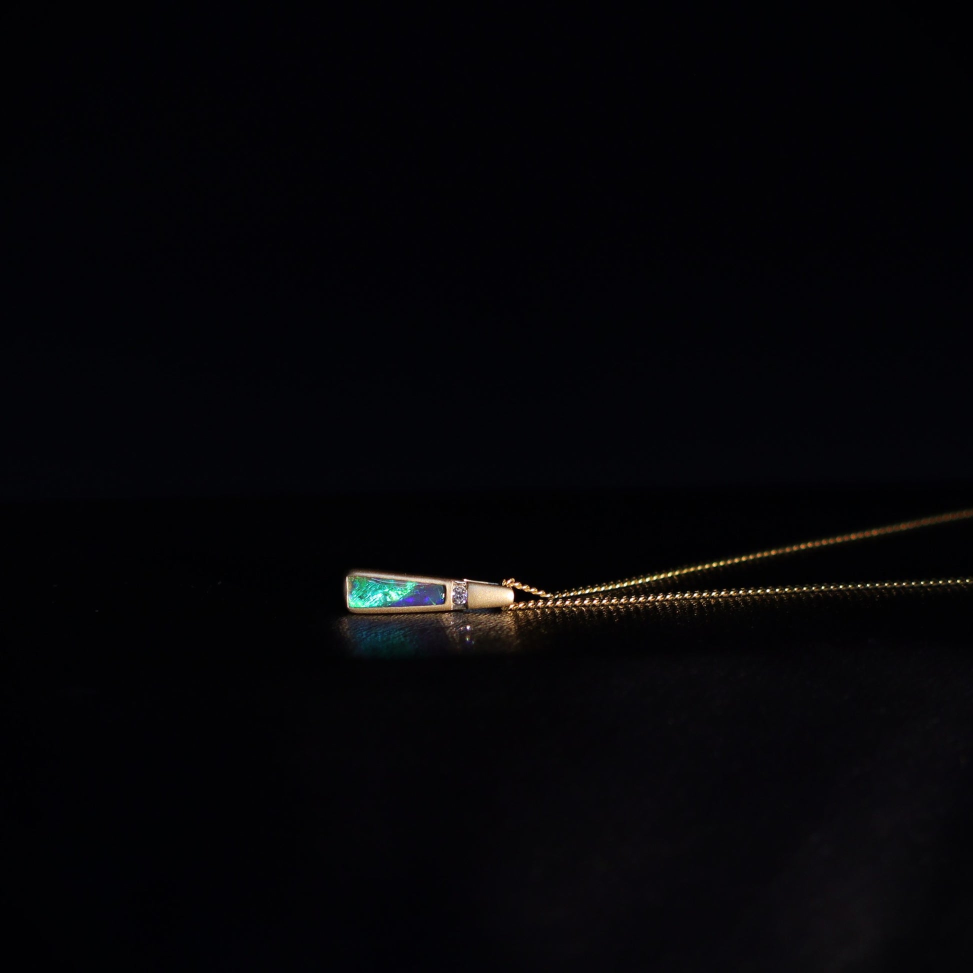 Australian Black Opal set in 18 K gold pendant
