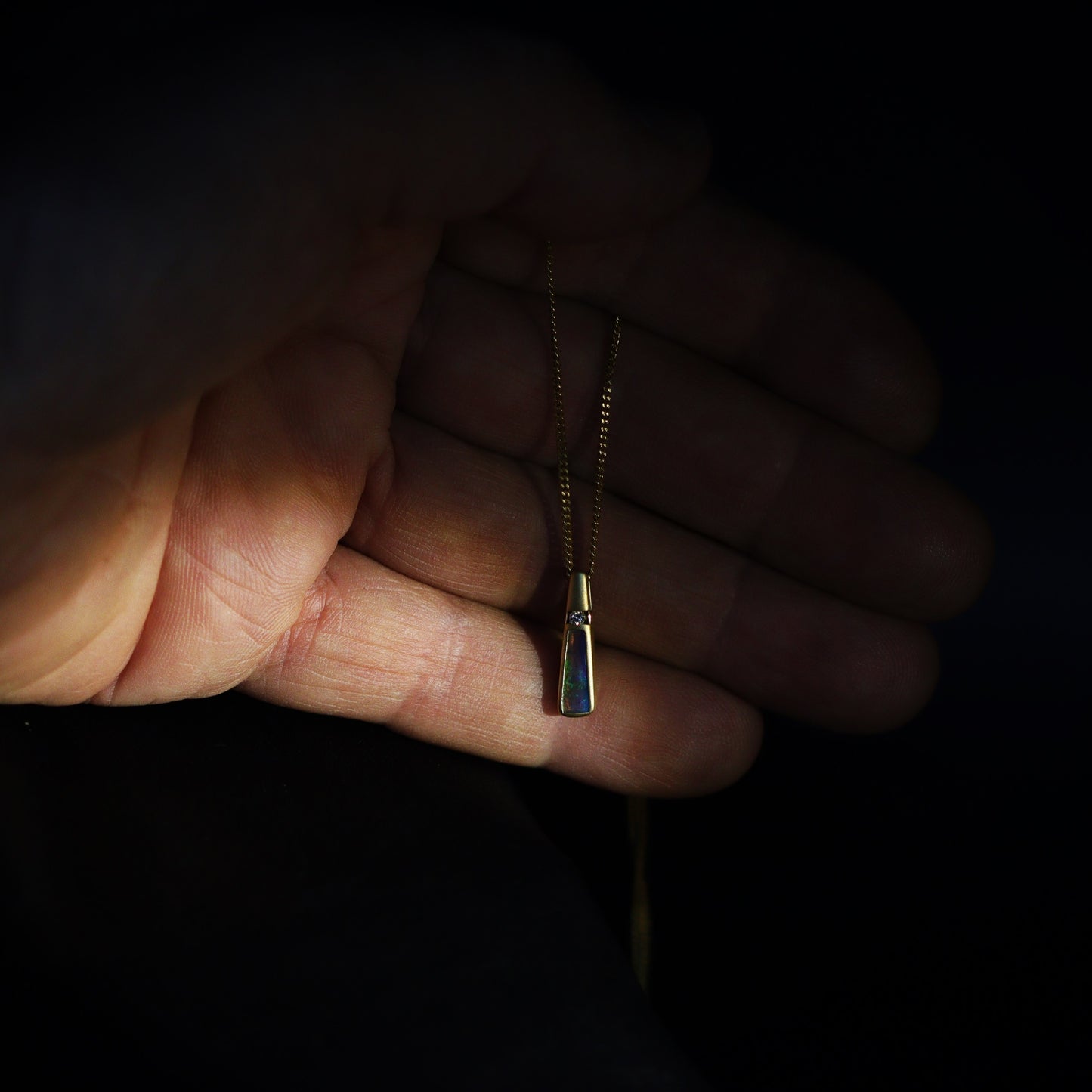 Australian Black Opal set in 18 K gold pendant