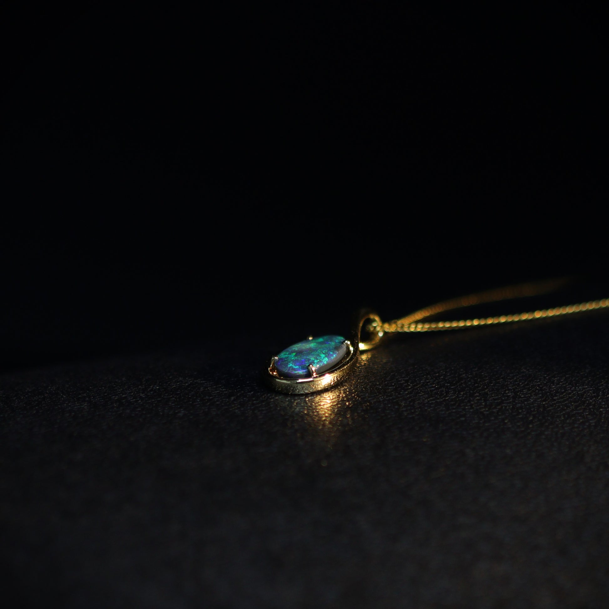 Australian Black opal set in 18 K gold pendant