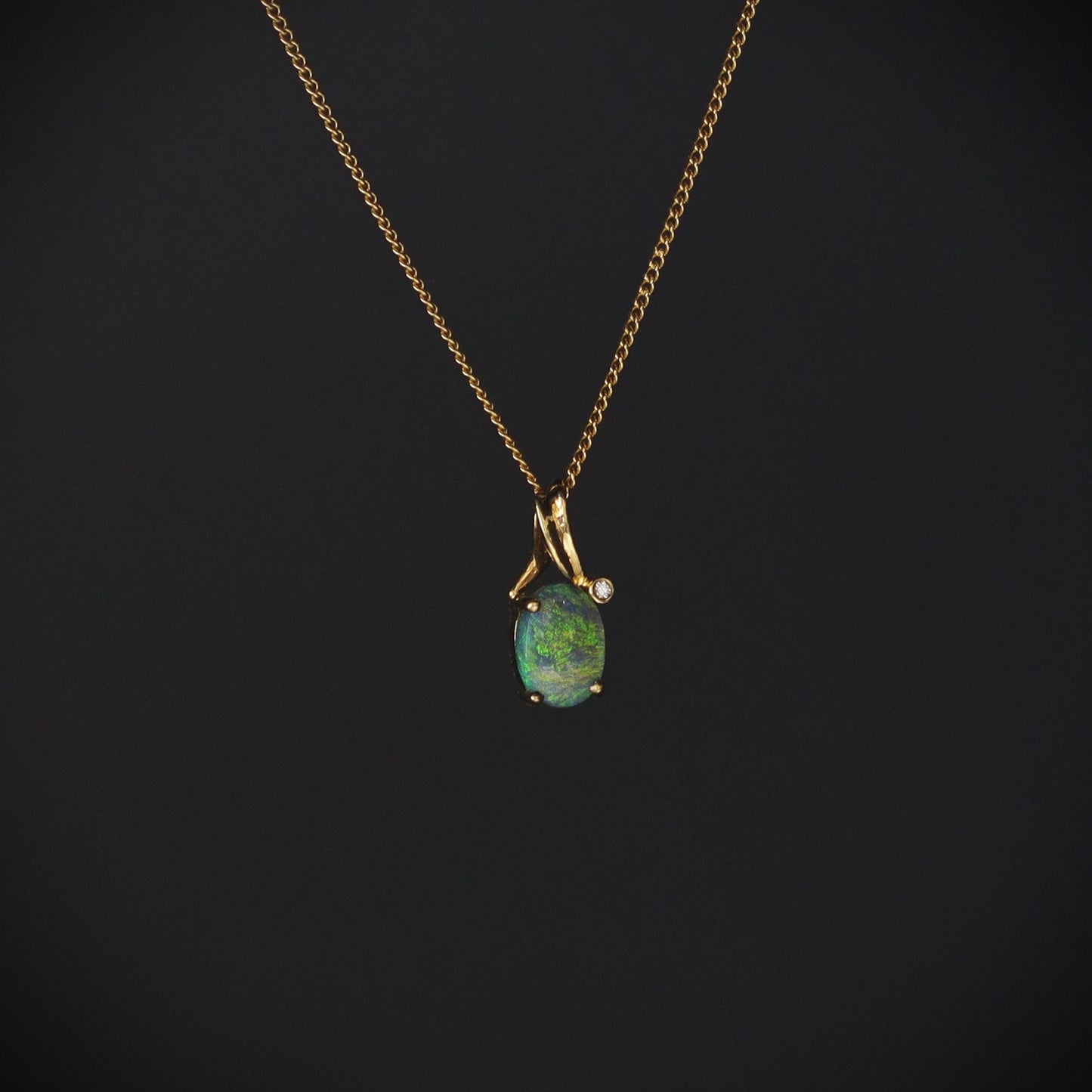 Australian Black Opal 18kt gold pendant 